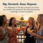 Four women enjoying drinks together with a cable car in the background