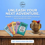 Promotional image of scratch-off adventure cards and a decorative container on a wooden surface with a blue background.